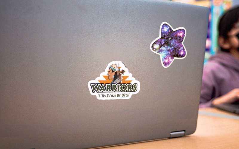 student laptop with school logo and star